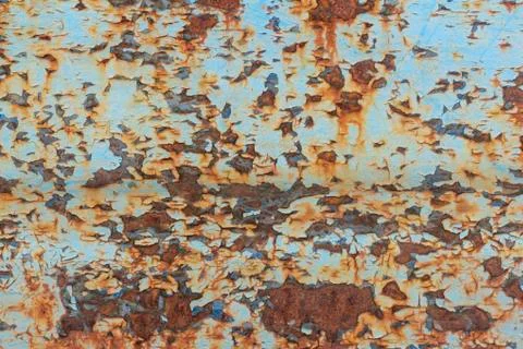 Rust.Old blue painted wall with rust spots.Textured rusty metal background. R Stock Photos