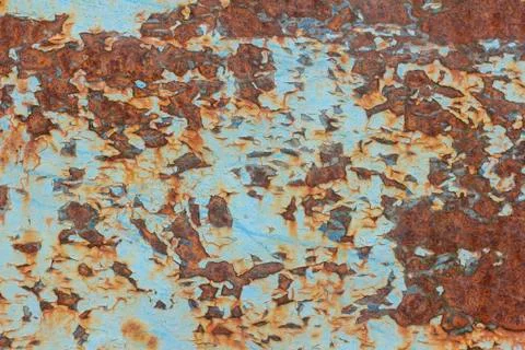 Rust.Old blue painted wall with rust spots.Textured rusty metal background. R Stock Photos
