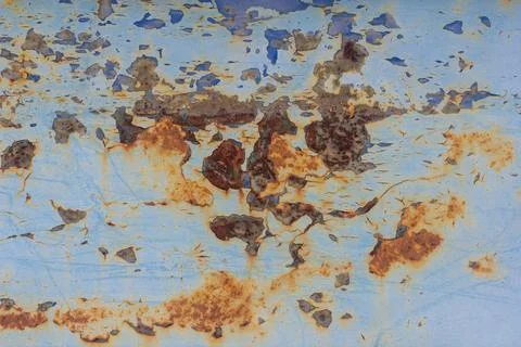 Rust.Old blue painted wall with rust spots.Textured rusty metal background. R Stock Photos