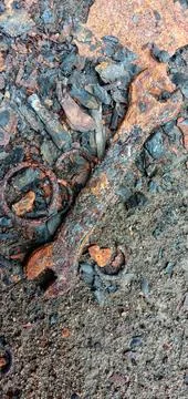 A rusty 10-12 size ring wrench on the cement floor Фото