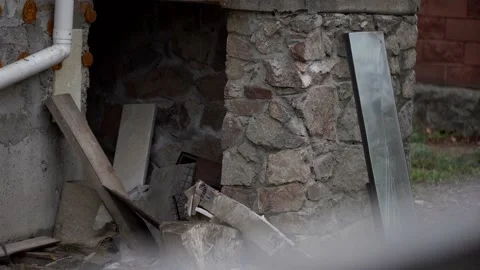 A rusty abandoned car in the parking lot, surrounded by a fence and barbed wire Stock Footage 175363617