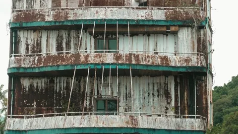 Rusty, abandoned ship with peeling paint and overgrown plants. Stock-Footage 286246909