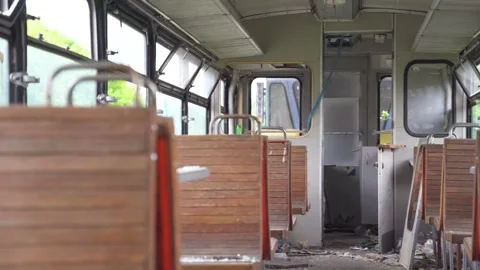 A rusty abandoned train in an overgrown area. Life after the apocalypse or Stock Footage 309006889