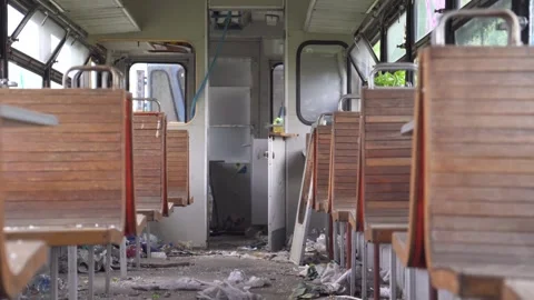 A rusty abandoned train in an overgrown area. Life after the apocalypse or Stock Footage 309007550