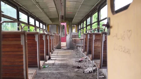 A rusty abandoned train in an overgrown area. Life after the apocalypse or Stock Footage 309012641