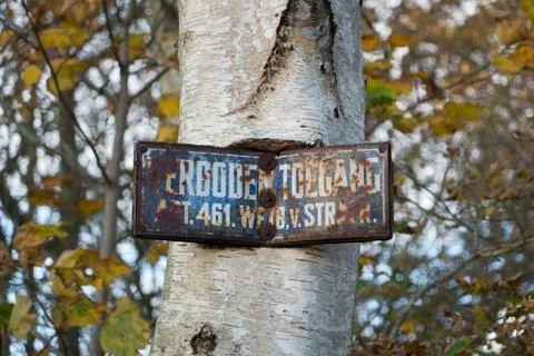 Rusty, almost unreadable sign Stock Photos