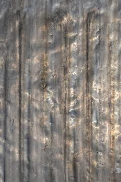 Rusty aluminum surface with texture, scratches, and dents outdoors Stock Photos