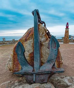 Rusty anchor with chain foreground Stock Photos