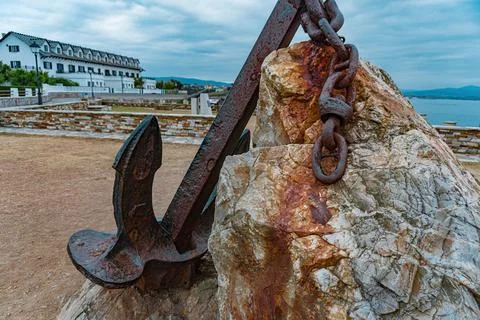 Rusty anchor with chain foreground Stock Photos