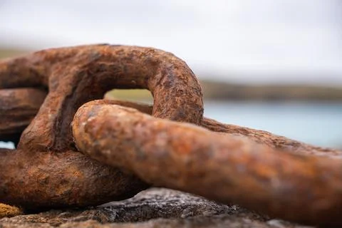 Rusty anchor chain link symbolizing strength and permanence Stock Photos