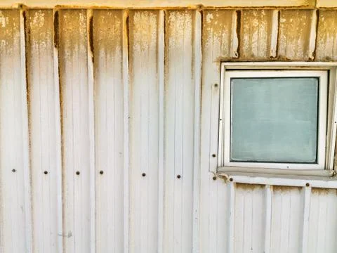 Rusty and dusty abandoned refugee camp and it's window Stock Photos