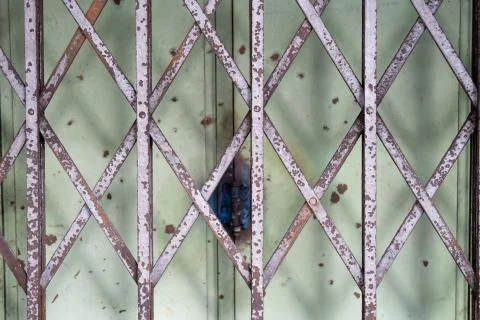 Rusty and old design grill door Stock Photos