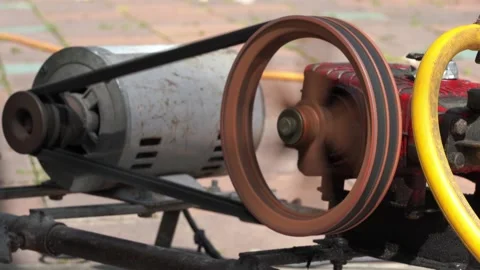 Rusty and old water pump motor working, Rotating pulley and belt on air pump  Stock Footage 130893131