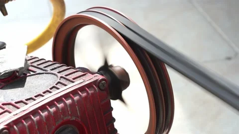 Rusty and old water pump motor working, Rotating pulley and belt on air pump Stock Footage 130893175