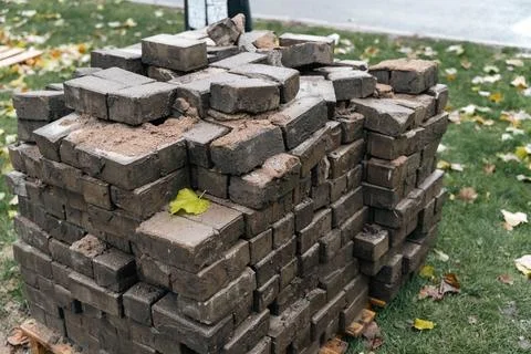 Rusty and worn-out paving slabs piled up during street renovation 스톡 사진