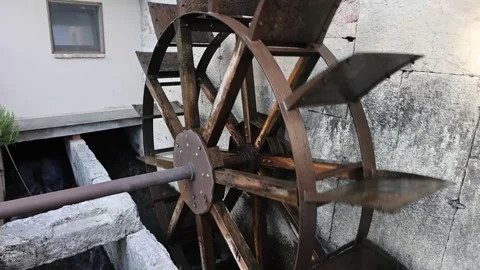 Rusty antique watermill wheel turning slowly Stock-Footage 337179775