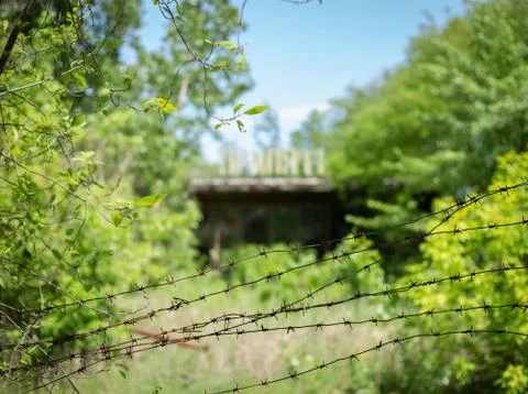Rusty barbed wire on the background of an abandoned cafe in the city of Pripy Stock Photos