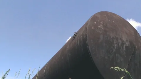 Rusty barrel against a blue sky Stock Footage 111967549