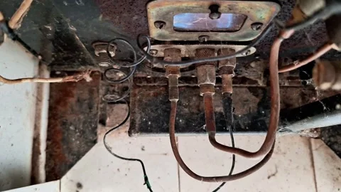 Rusty Boiler Burner Assembly with Exposed Copper Pipes and Electrical Wires Vídeos de archivo 348193538