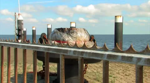 Rusty bolder in the harbor Stock Footage 8836599