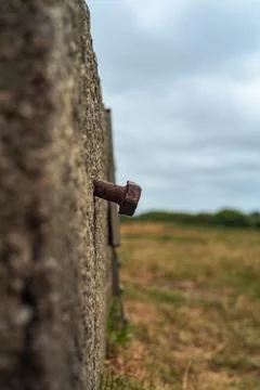 Rusty bolt embedded in granit stone monument in rural Cornwall Stock Photos