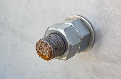 Rusty bolt with two nuts close up Stock Photos