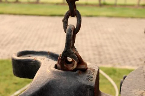 Rusty Bolt Type Anchor Shackles , hook on chain ,climbing carabiner  on green Stock Photos