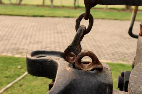 Rusty Bolt Type Anchor Shackles , hook on chain ,climbing carabiner  on green Stock Photos