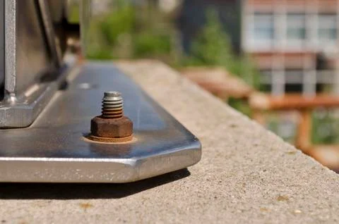 Rusty bolt in weathered nut outside Stock Photos