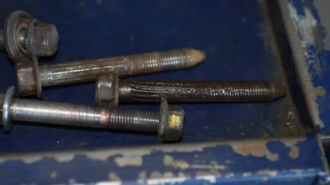 Rusty Bolts on Workshop Surface Stock Footage 345565320