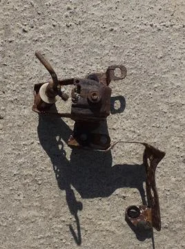 Rusty brake distributor on a grey background. Stock Photos