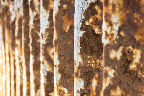 Rusty bridge railing texture background with cracked white paint Stock Photos