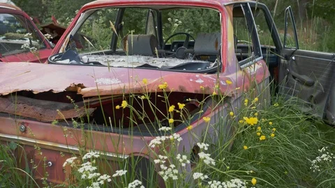 Rusty broken abandoned car on old cars junkyard cemetery. Gimbal shot, 4K Video stock 124312536