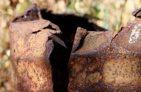 Rusty, broken barrel. Stock Photos