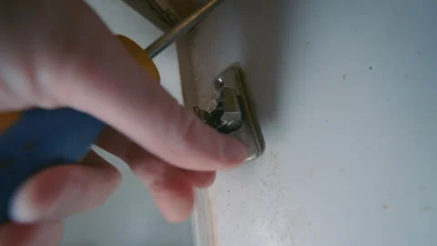 Rusty Broken Cabinet Door Hinge Being Removed by Hand | Close-Up Parallax View Stock Footage 335108491