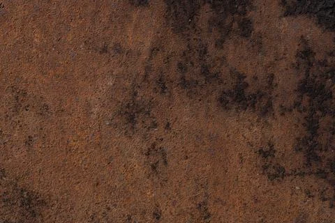 Rusty brown stained background, old grungy iron surface Stock Photos