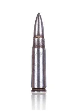 Rusty bullet close-up on white background Stock Photos