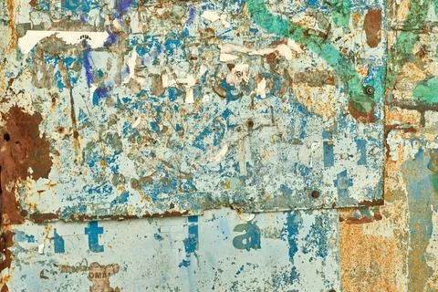Rusty bulletin board close up. Peeling paint on metal sheet. Old blue iron .. Stock Photos
