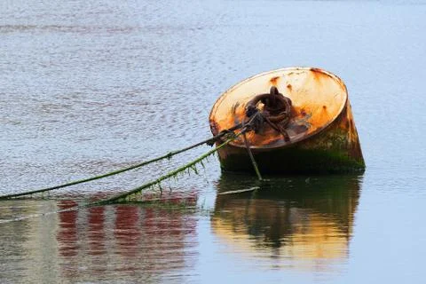 Rusty buoy with ropes Stock Photos