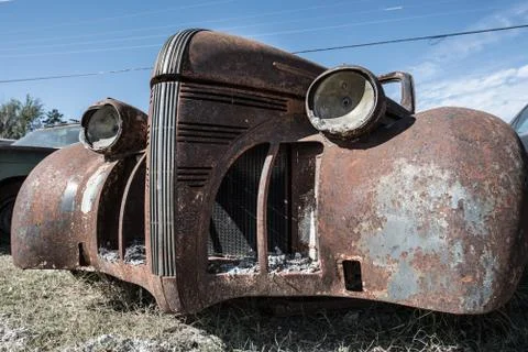 Rusty Burned Classic Car with Ashes Stock Photos