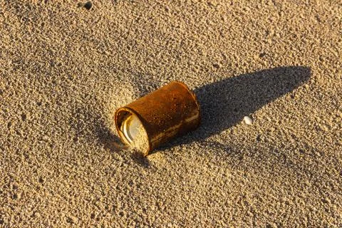 Rusty can on sand Stock Photos
