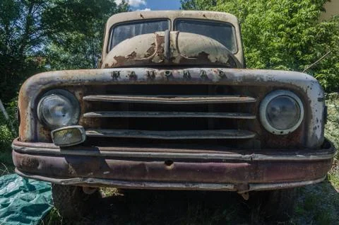 Rusty car front view on a junkyard Stock Photos