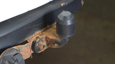 Rusty car tow hitch ball mount with a black cap. Stock Footage 344364473