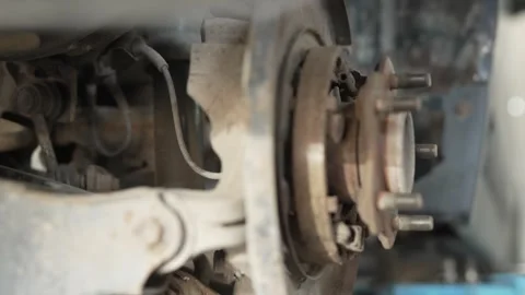 A rusty car wheel hub assembly exposed during brake repair. Stock Footage 342263464