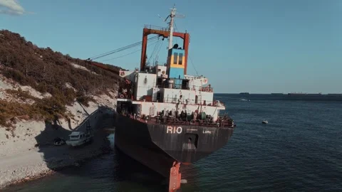 Rusty cargo ship washed ashore after the tsunami. Shipwreck Vidéo 330259901