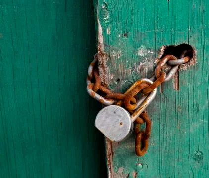 Rusty chain and pad lock. Stock Photos