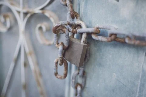 Rusty chain and padlock on a gate Stock Photos