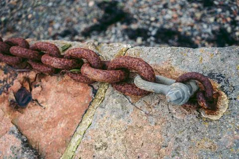 Rusty chain at the bay Stock Photos
