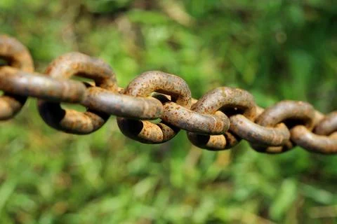 Rusty chain with blurred background Stock Photos