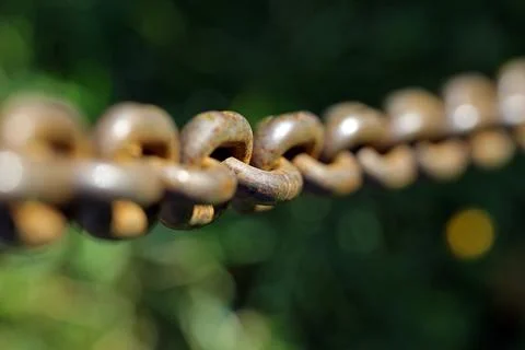 Rusty chain with blurred background Stock Photos